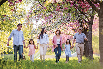A family walking outside together. Links to Closely Held Business Stock