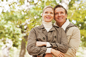 A couple smiling. Links to Donor-Advised Funds